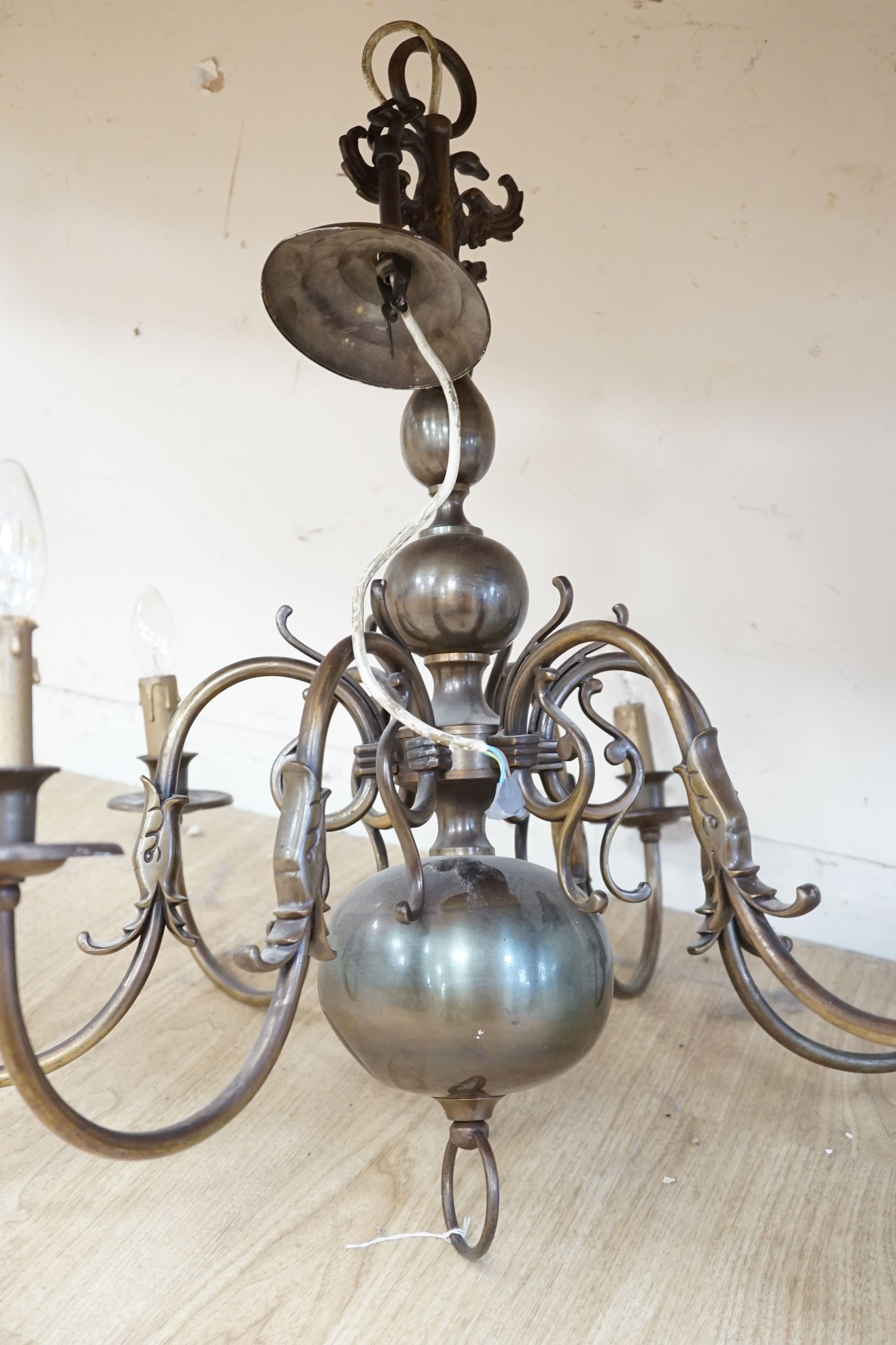 A six light brass Dutch style electrolier, 75 cms high.